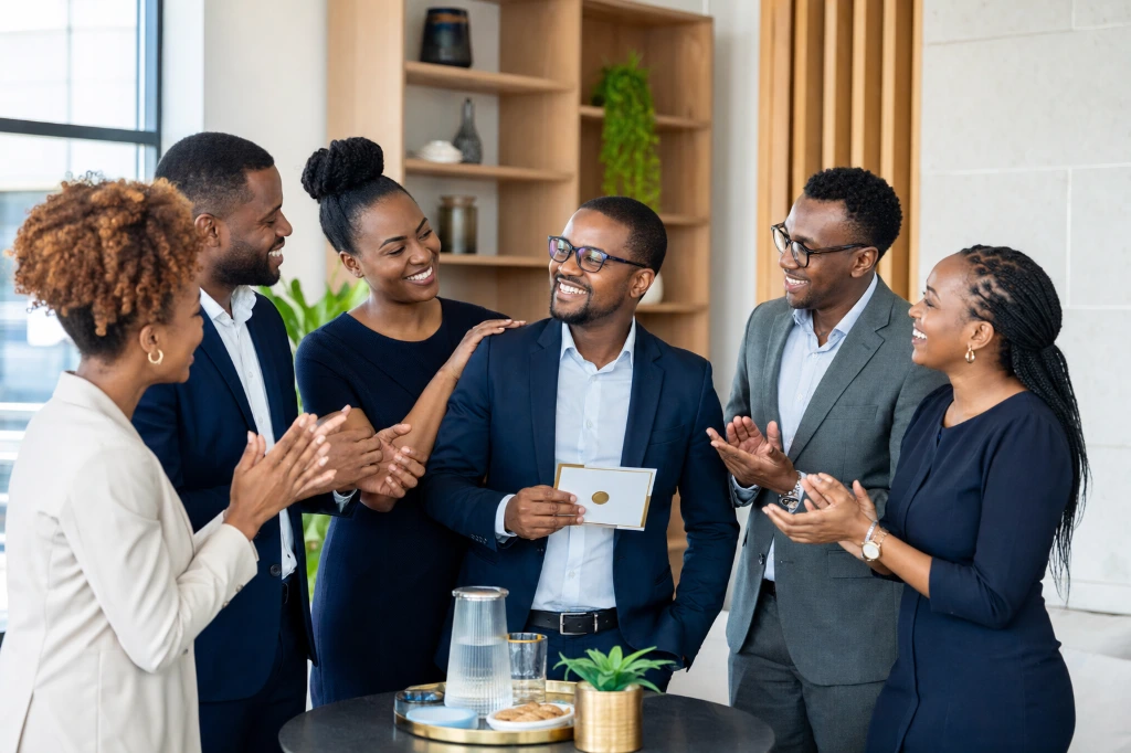Diverse professionals connecting and exchanging ideas during a workplace networking session.